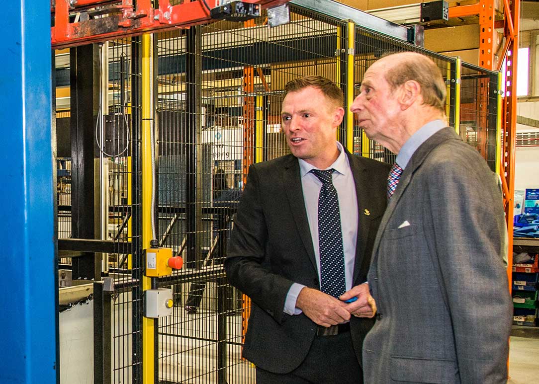 two men looking at machinery